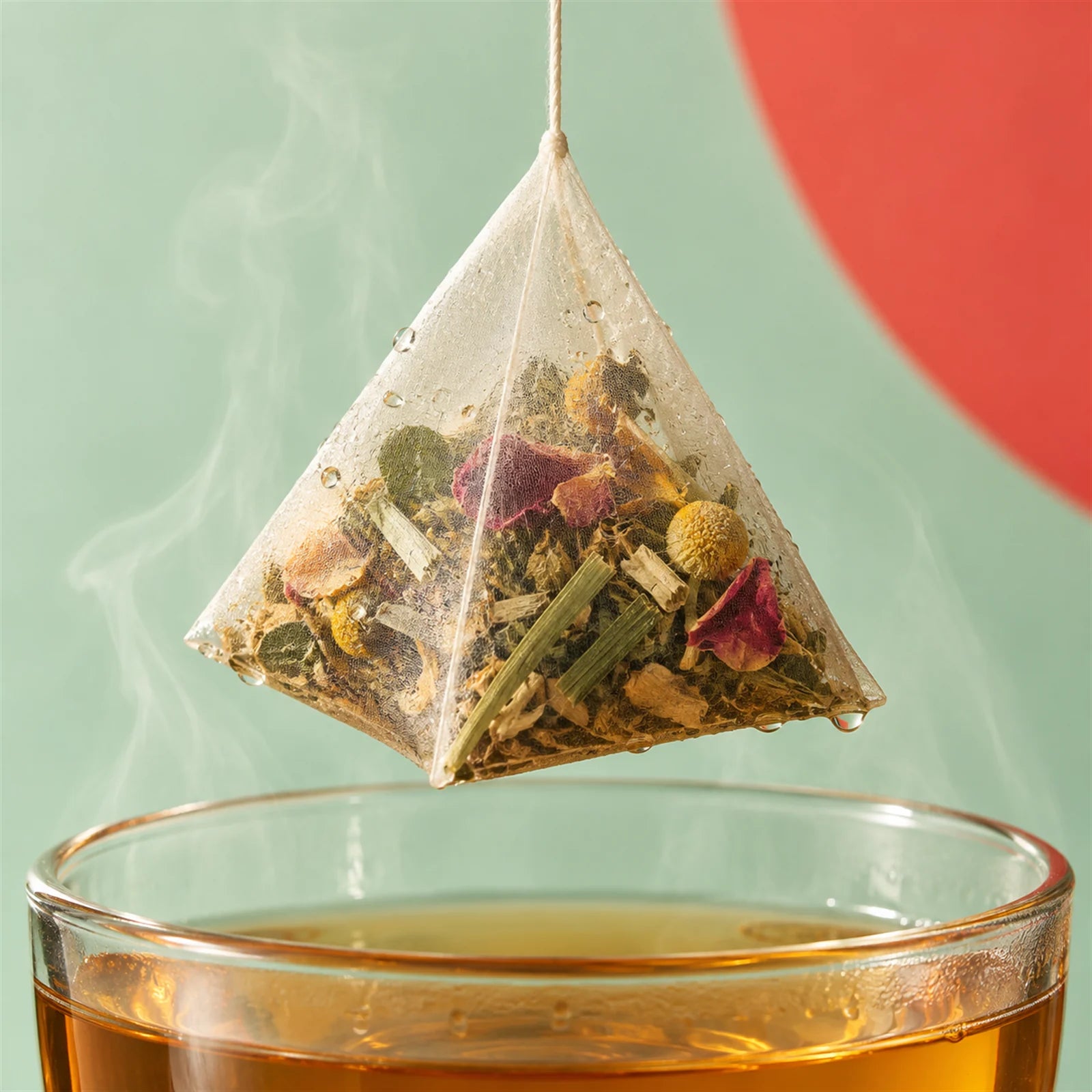 Close-up of a pyramid infusion bag filled with whole herbs