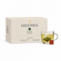 HAUS PAUS EASE digestive herbal tea box with a freshly brewed cup