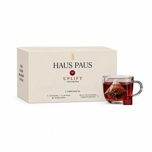 HAUS PAUS UPLIFT energy herbal tea box with a freshly brewed cup
